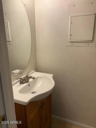 a bathroom with a sink and mirror