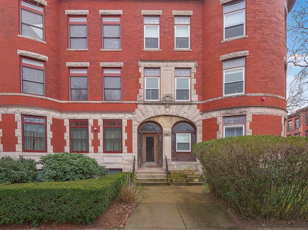 1871 Beacon Street, Unit 4 Brookline, MA 02445 - Photo 1 of 14 a front view of a building with garden