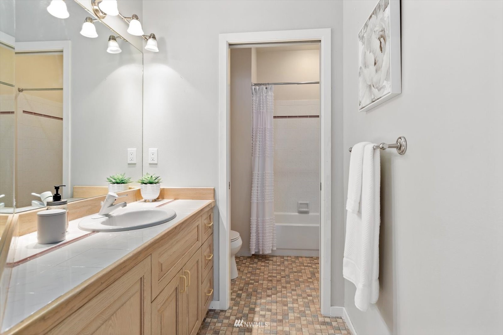 13629 3rd Drive Southeast Everett, WA 98208 - Photo 19 of 40 a bathroom with a sink a vanity and a mirror