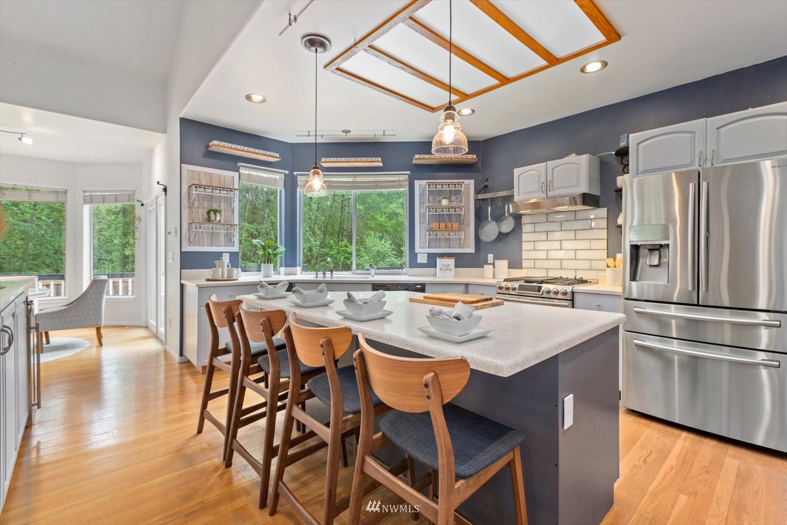 13629 3rd Drive Southeast Everett, WA 98208 - Photo 29 of 40 a kitchen with a table chairs and refrigerator