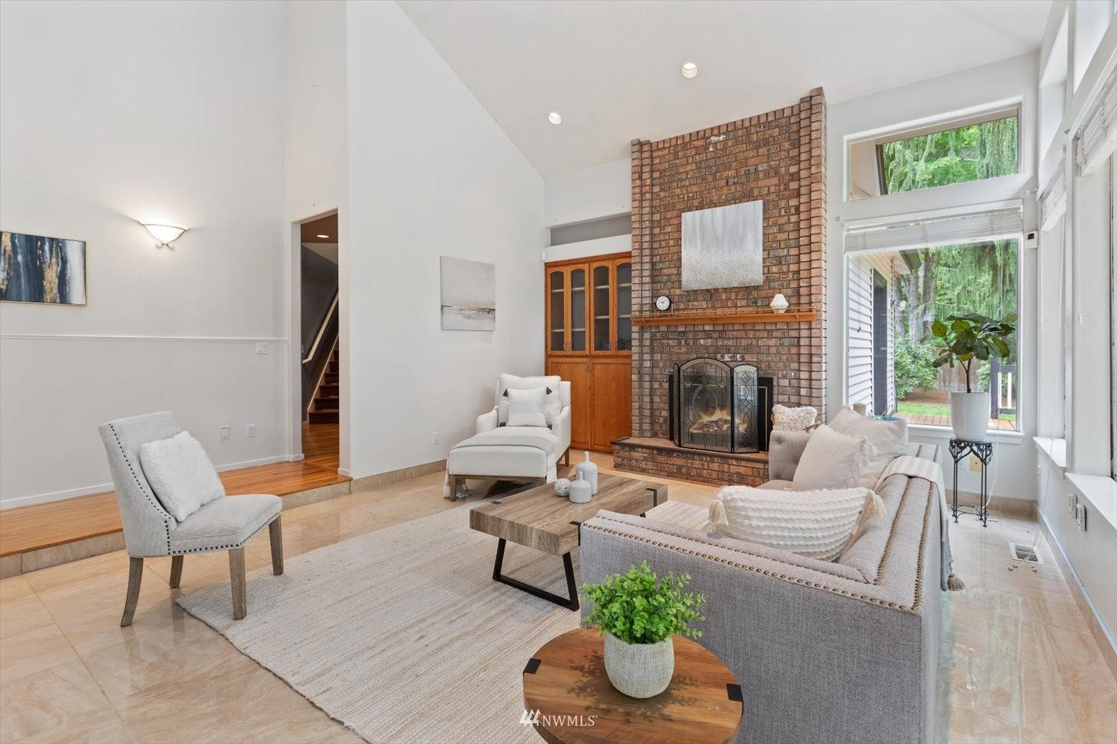 13629 3rd Drive Southeast Everett, WA 98208 - Photo 32 of 40 a living room with furniture fireplace and a table