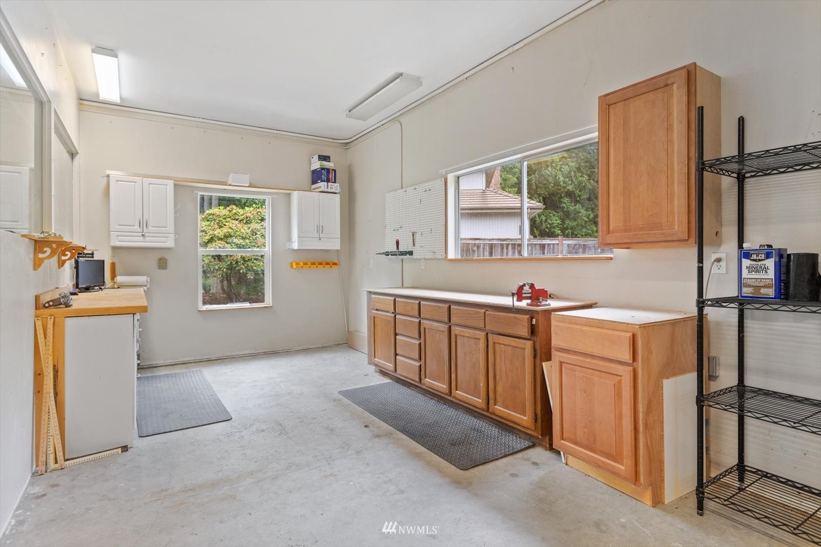 13629 3rd Drive Southeast Everett, WA 98208 - Photo 34 of 40 a kitchen with stainless steel appliances kitchen island wooden cabinets a stove a sink and a large window
