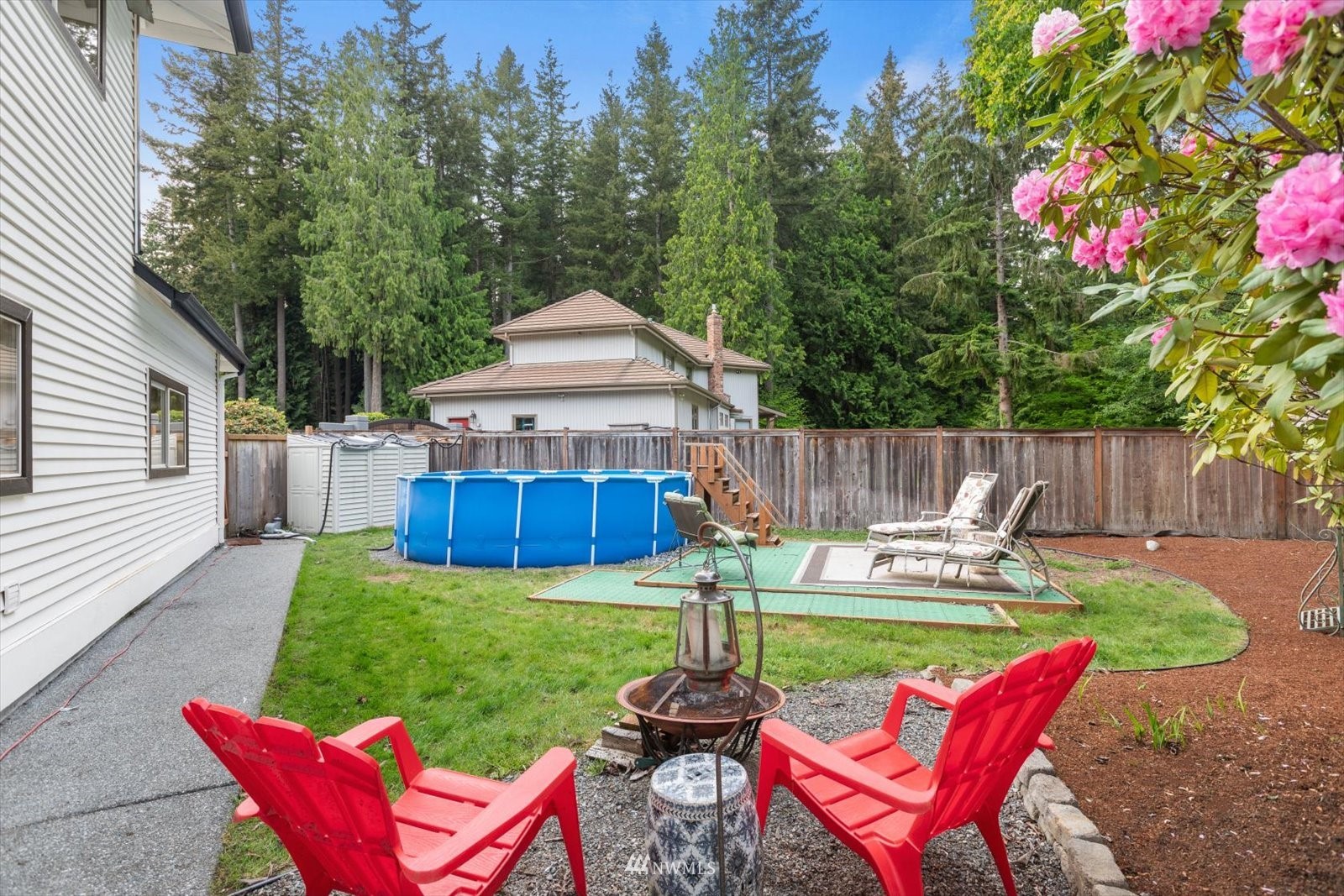 13629 3rd Drive Southeast Everett, WA 98208 - Photo 36 of 40 a view of a chair and table in back yard of the house