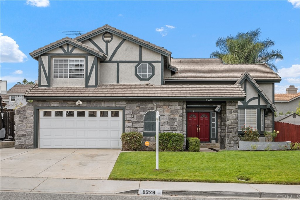 9229 Stephanie Street Riverside, CA 92508 - Photo 1 of 1 a front view of a house with a yard