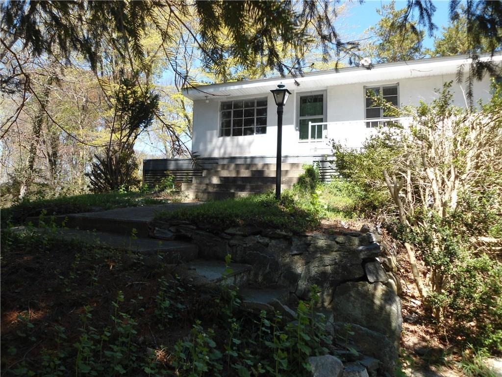 12 Lloyd Road Waterford, CT 06385 - Photo 1 of 1 a view of a house with backyard and garden