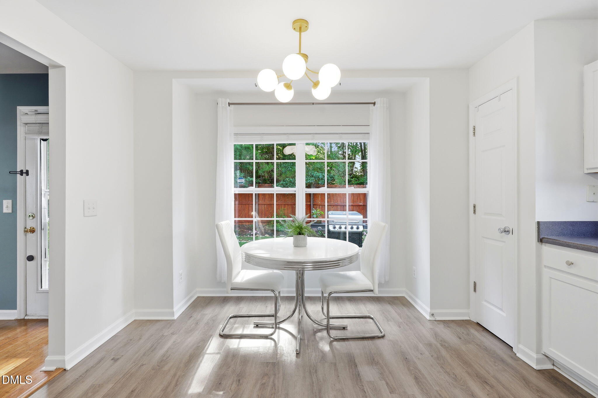 4232 Dalcross Road Raleigh, NC 27610 - Photo 15 of 42 a living room with a toilet and a dining table
