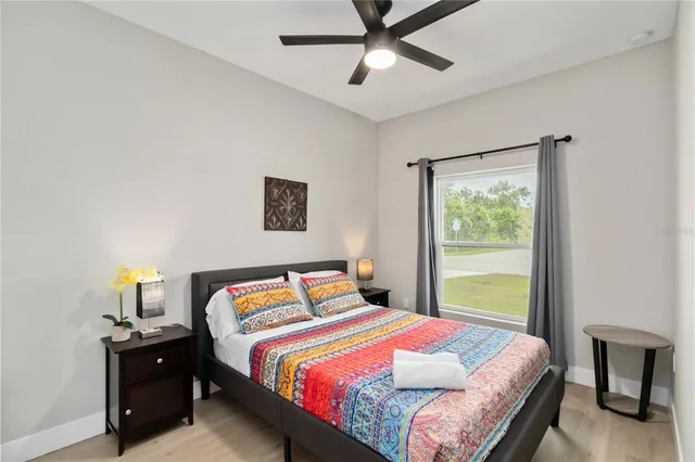 a bedroom with a bed and a window