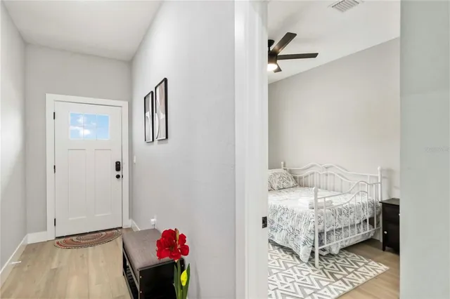 a bedroom with a bed and a window