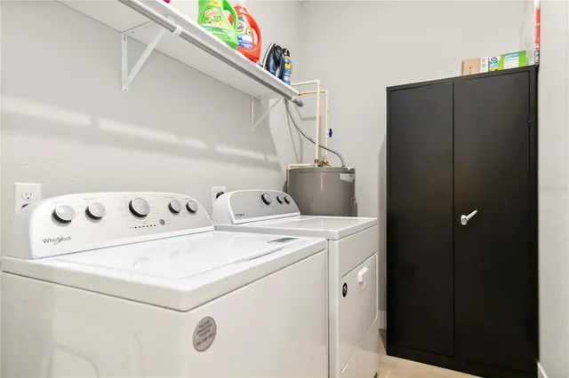 a utility room with dryer and washer