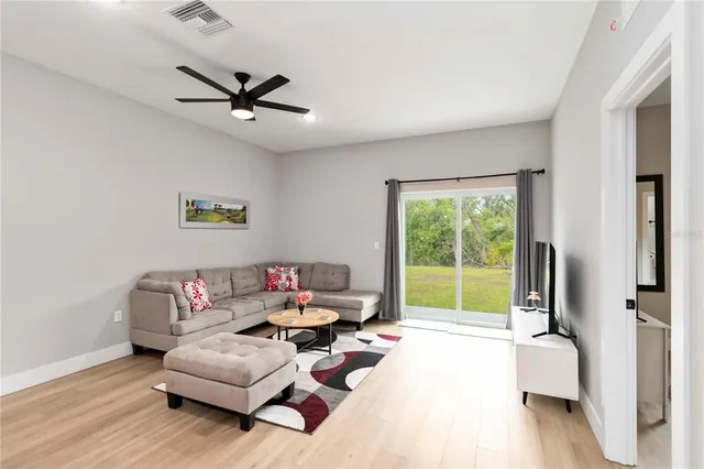 a living room with furniture and a window
