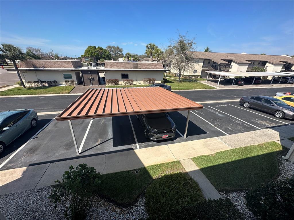 5154 Turquoise Lane, Unit 206 New Port Richey, FL 34652 - Photo 18 of 54 a view of swimming pool with outdoor seating and city view