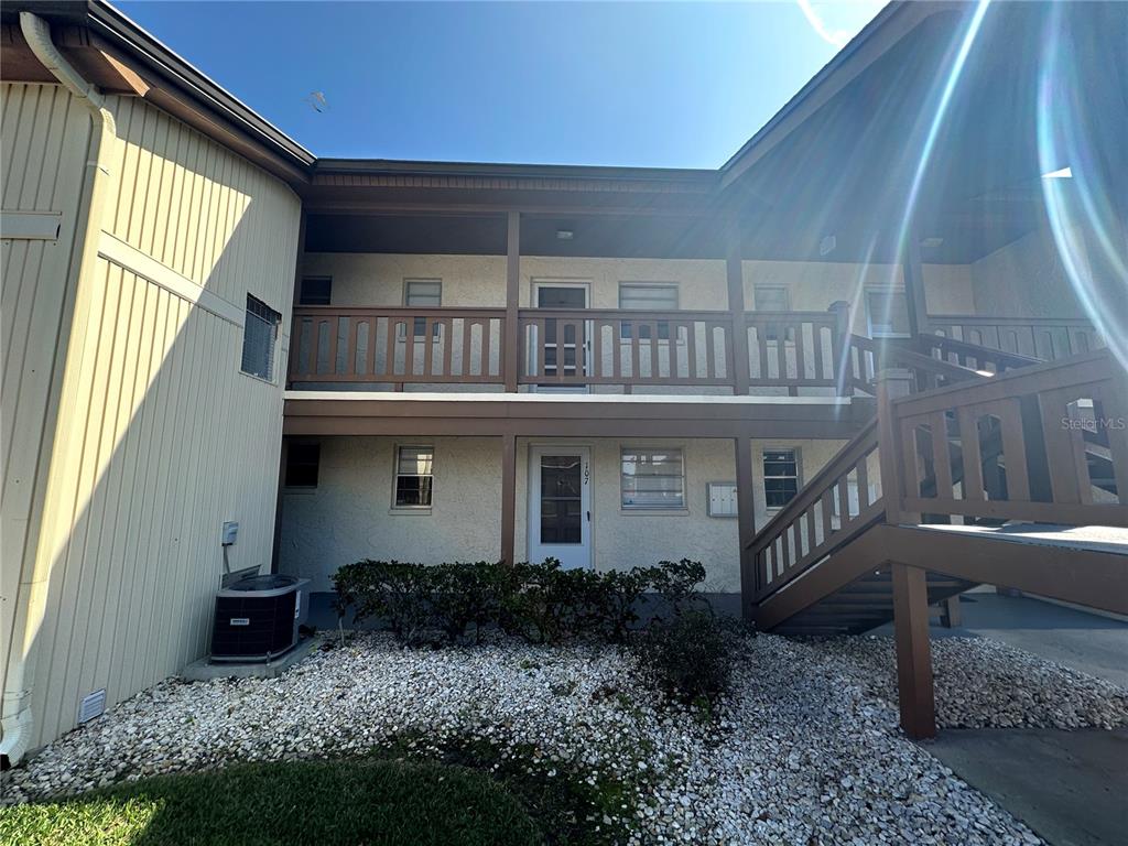 5154 Turquoise Lane, Unit 206 New Port Richey, FL 34652 - Photo 2 of 54 a view of a house with backyard and sitting area