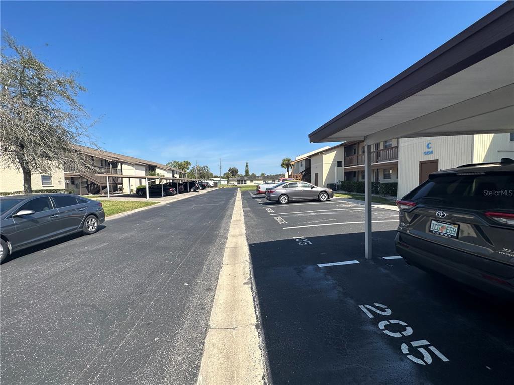 5154 Turquoise Lane, Unit 206 New Port Richey, FL 34652 - Photo 22 of 54 a view of street with parked cars