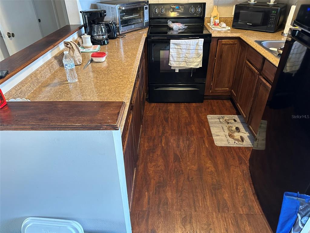 5154 Turquoise Lane, Unit 206 New Port Richey, FL 34652 - Photo 25 of 54 a view of workspace with wooden floor