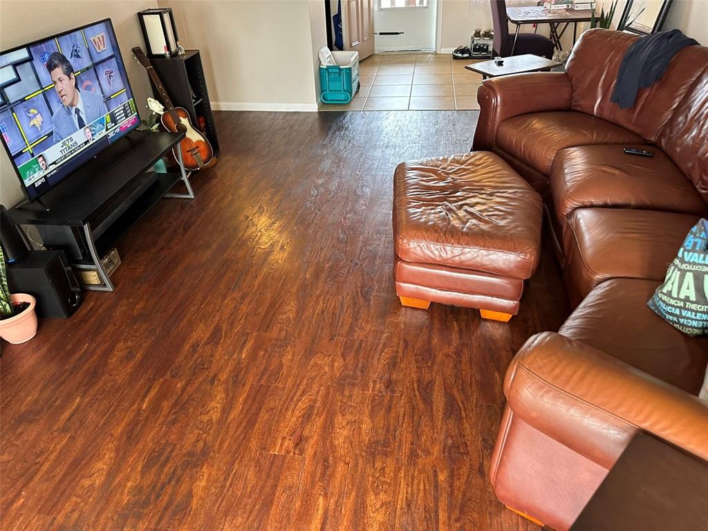 5154 Turquoise Lane, Unit 206 New Port Richey, FL 34652 - Photo 38 of 54 a living room with furniture and a wooden floor