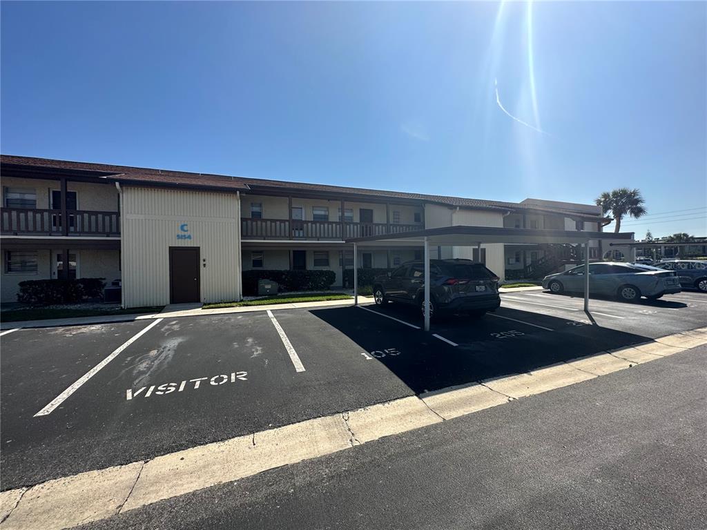 5154 Turquoise Lane, Unit 206 New Port Richey, FL 34652 - Photo 4 of 54 a view of a street with houses