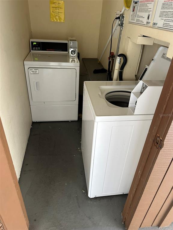 5154 Turquoise Lane, Unit 206 New Port Richey, FL 34652 - Photo 49 of 54 a utility room with dryer and washer