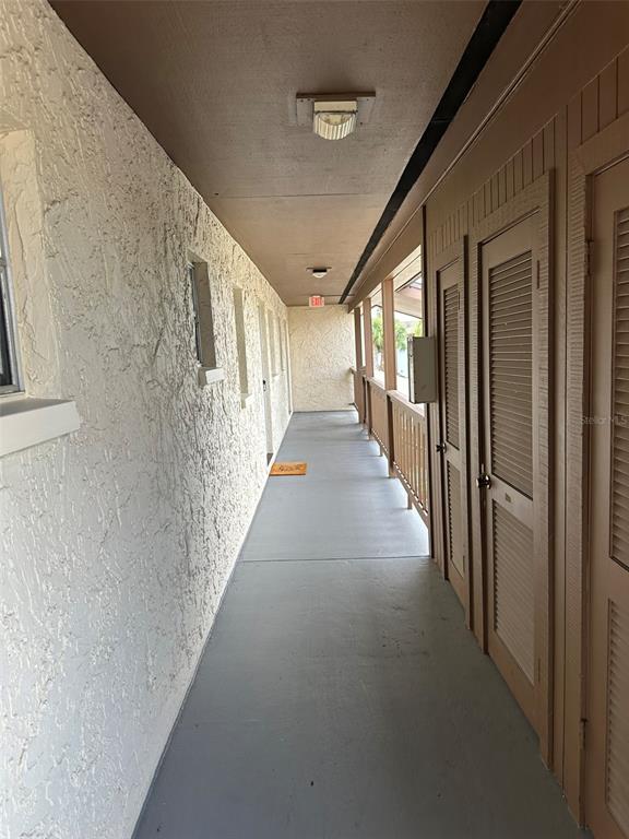 5154 Turquoise Lane, Unit 206 New Port Richey, FL 34652 - Photo 54 of 54 a view of a hallway with stairs