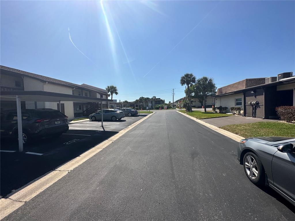 5154 Turquoise Lane, Unit 206 New Port Richey, FL 34652 - Photo 9 of 54 a view of a street with cars