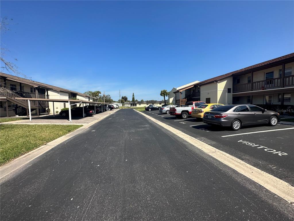 5154 Turquoise Lane, Unit 206 New Port Richey, FL 34652 - Photo 10 of 54 a view of a street with cars