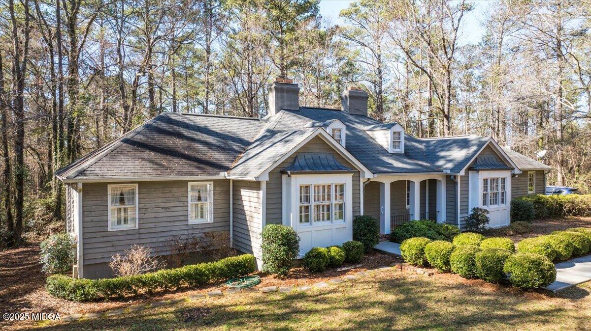 a front view of a house with garden
