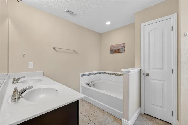 a bathroom with a sink and a bathtub