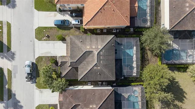 a aerial view of a house with table and chairs