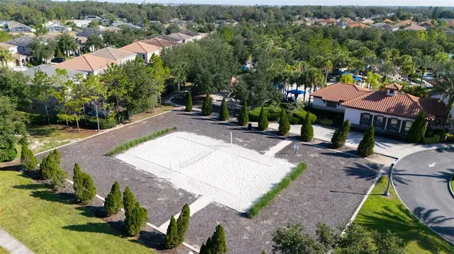 an aerial view of a house with yard swimming pool and outdoor seating