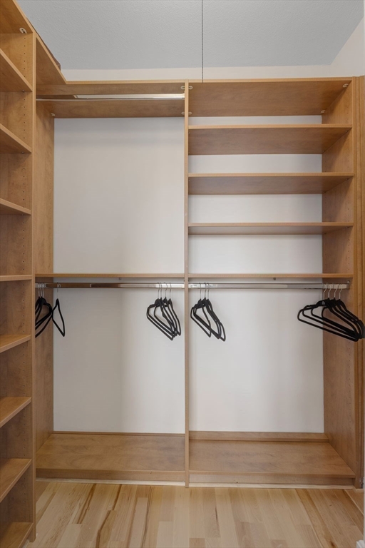 6 Whittier Place, Unit 7E Boston, MA 02114 - Photo 20 of 33 a view of a room with racks on the wall