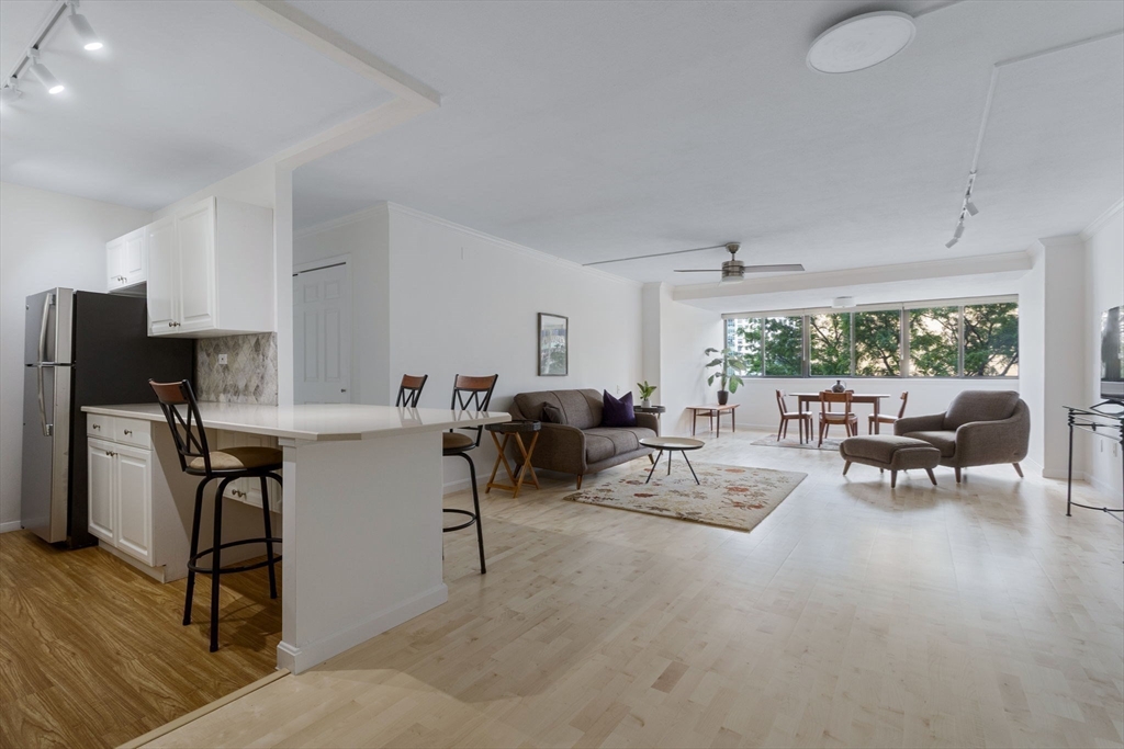 6 Whittier Place, Unit 7E Boston, MA 02114 - Photo 4 of 33 a living room with furniture and a window