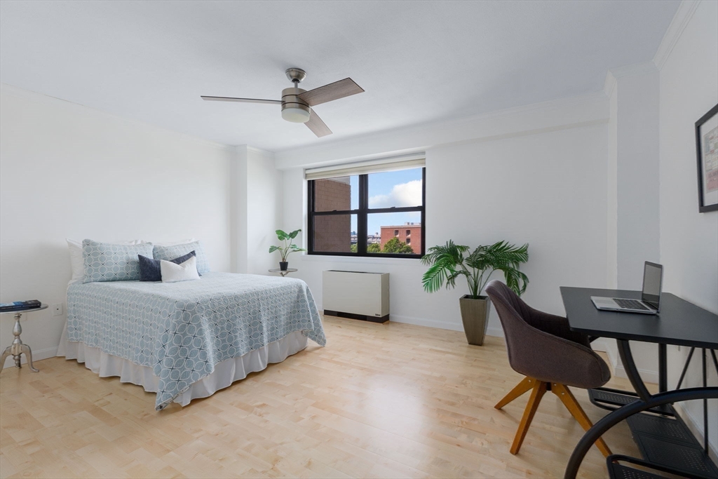 6 Whittier Place, Unit 7E Boston, MA 02114 - Photo 7 of 33 a living room with furniture and a window