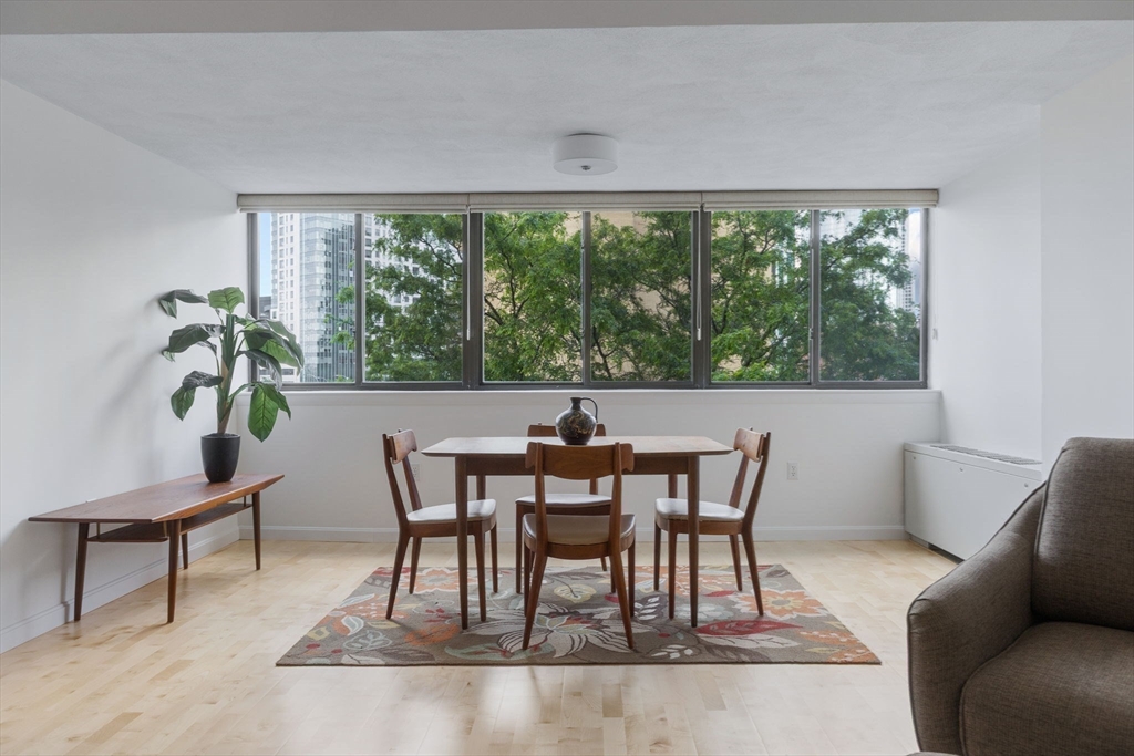 6 Whittier Place, Unit 7E Boston, MA 02114 - Photo 10 of 33 a view of a dining room with furniture window and outside view