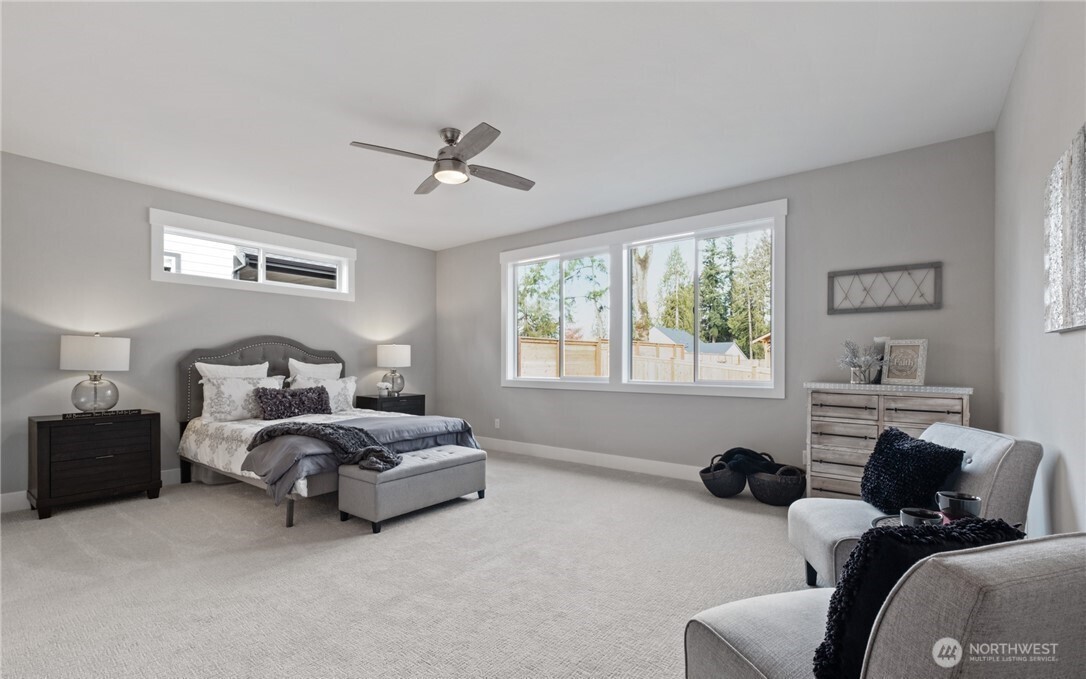 8831 27th Street East Edgewood, WA 98371 - Photo 17 of 27 a bed room with bed and a window