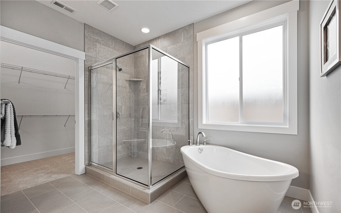 8831 27th Street East Edgewood, WA 98371 - Photo 20 of 27 a white toilet sitting next to a shower