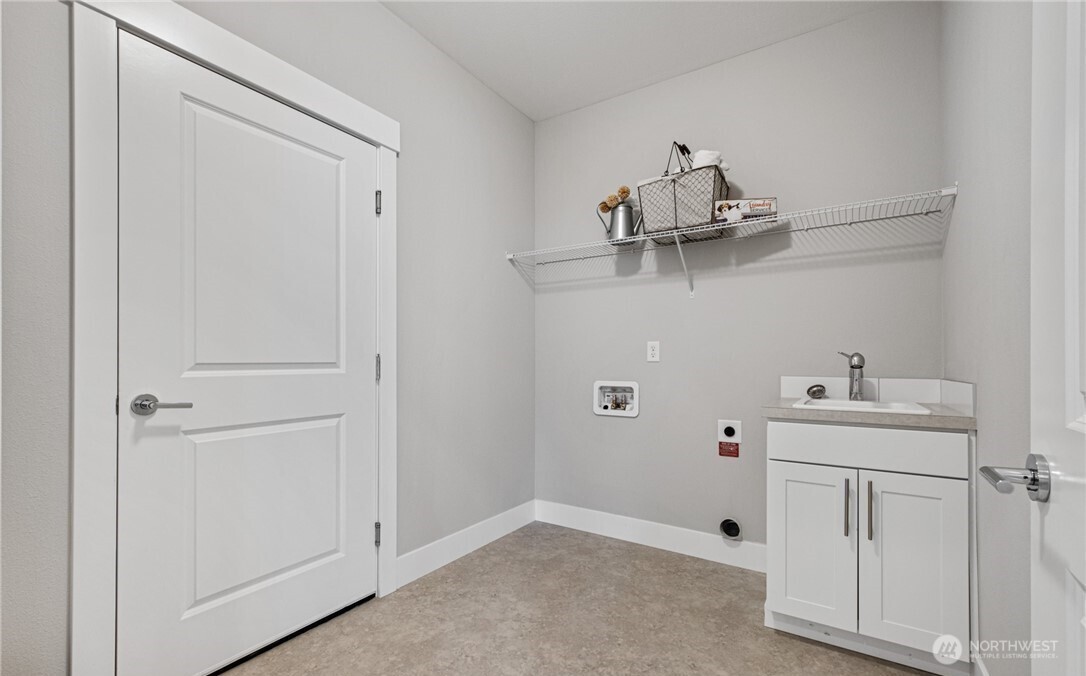 8831 27th Street East Edgewood, WA 98371 - Photo 21 of 27 a view of cabinets with sink