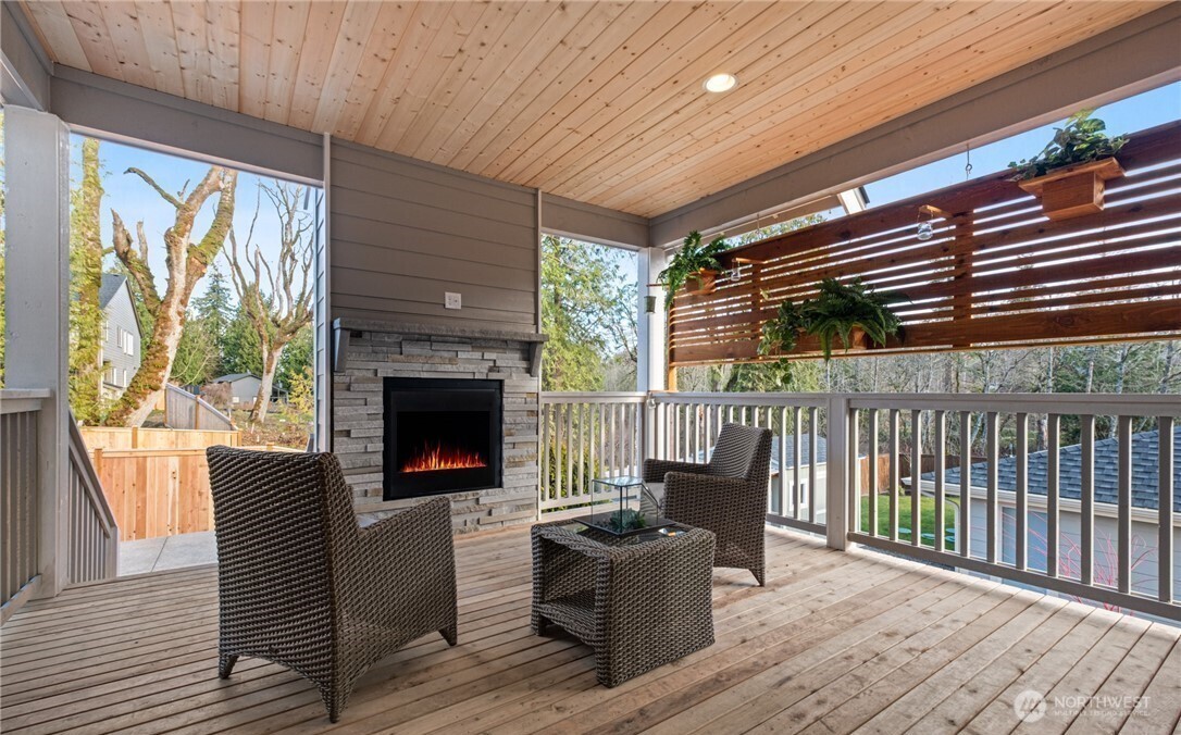8831 27th Street East Edgewood, WA 98371 - Photo 23 of 27 a living room with furniture and a fireplace