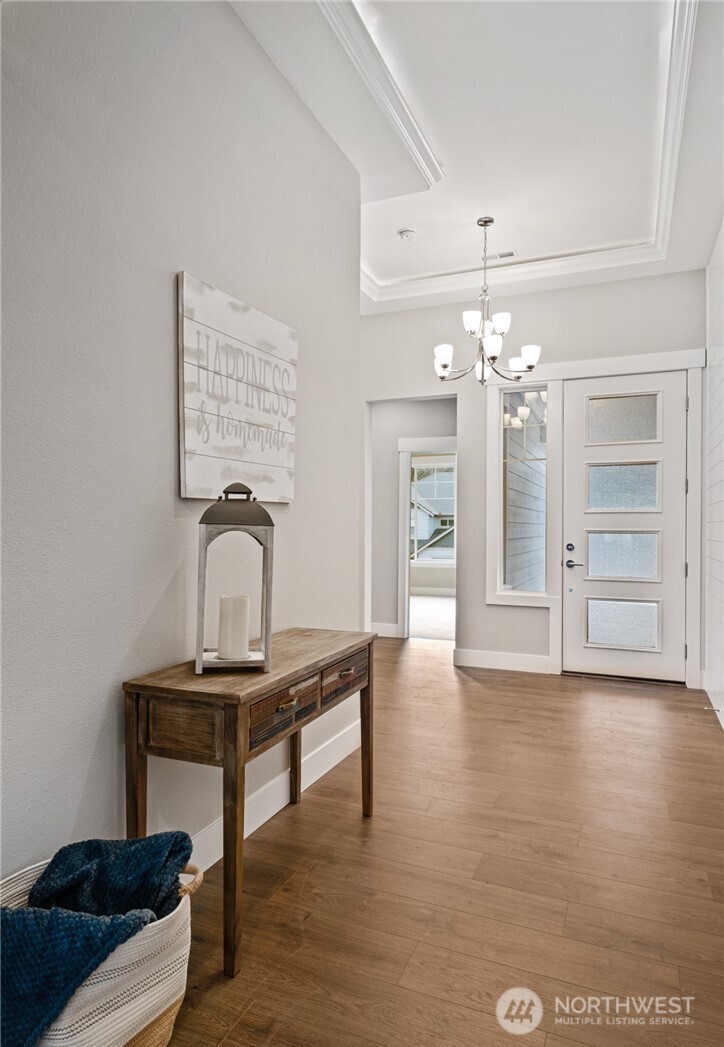 8831 27th Street East Edgewood, WA 98371 - Photo 4 of 27 a view of a livingroom with furniture and chandelier