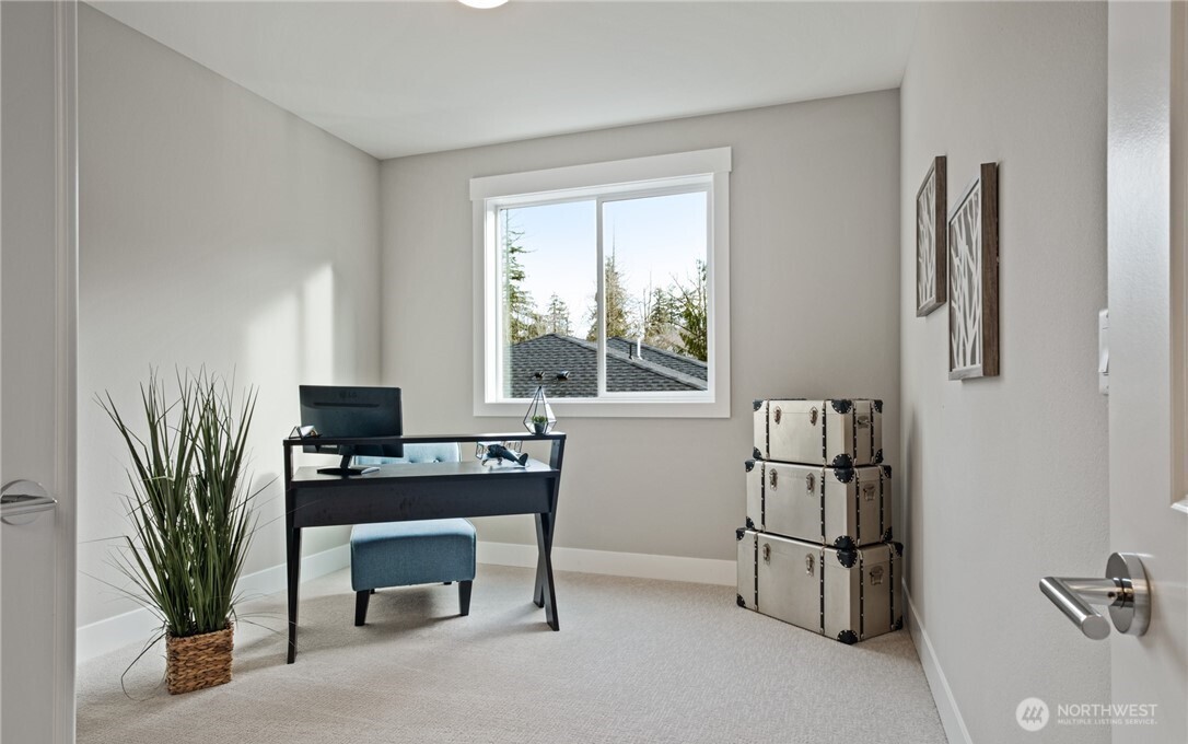 8831 27th Street East Edgewood, WA 98371 - Photo 5 of 27 a view of a workspace with a window and storage