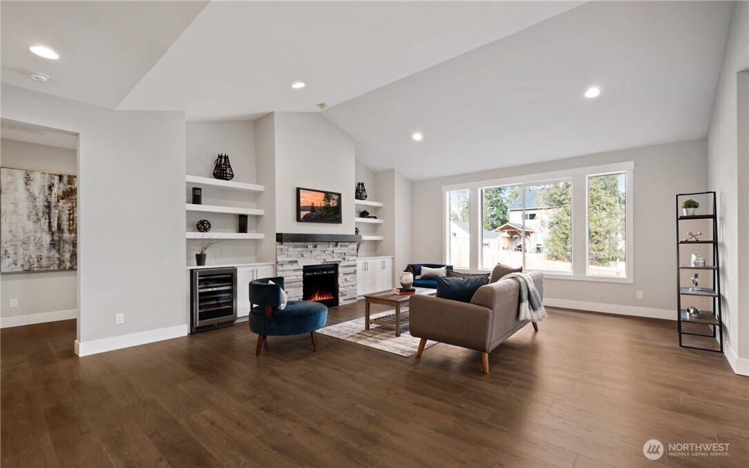 8831 27th Street East Edgewood, WA 98371 - Photo 6 of 27 a living room with furniture window and fireplace
