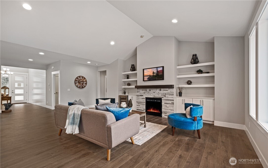 8831 27th Street East Edgewood, WA 98371 - Photo 7 of 27 a living room with furniture fireplace and window