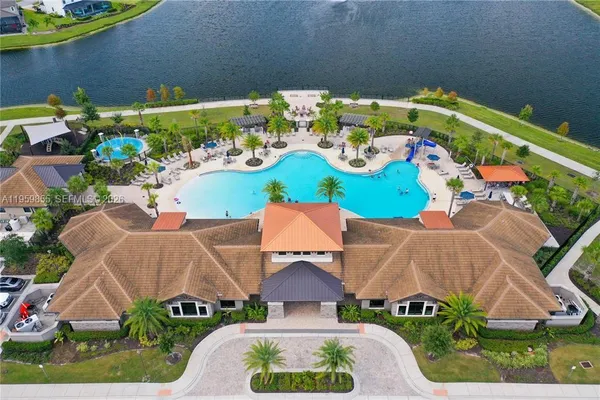 an aerial view of a house with a yard basket ball court