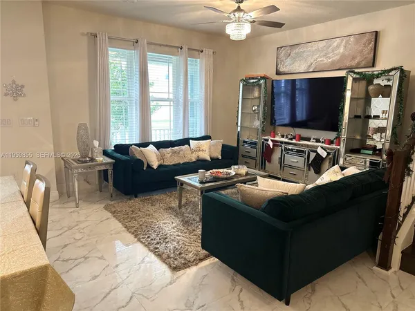 a dining room with furniture and wooden floor