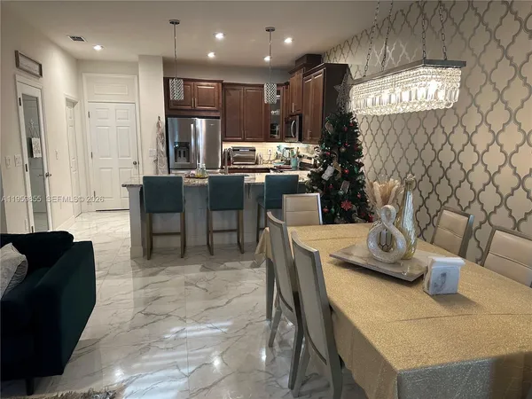 a view of a room with furniture and wooden floor