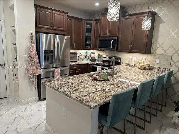 a kitchen with a sink and a stove