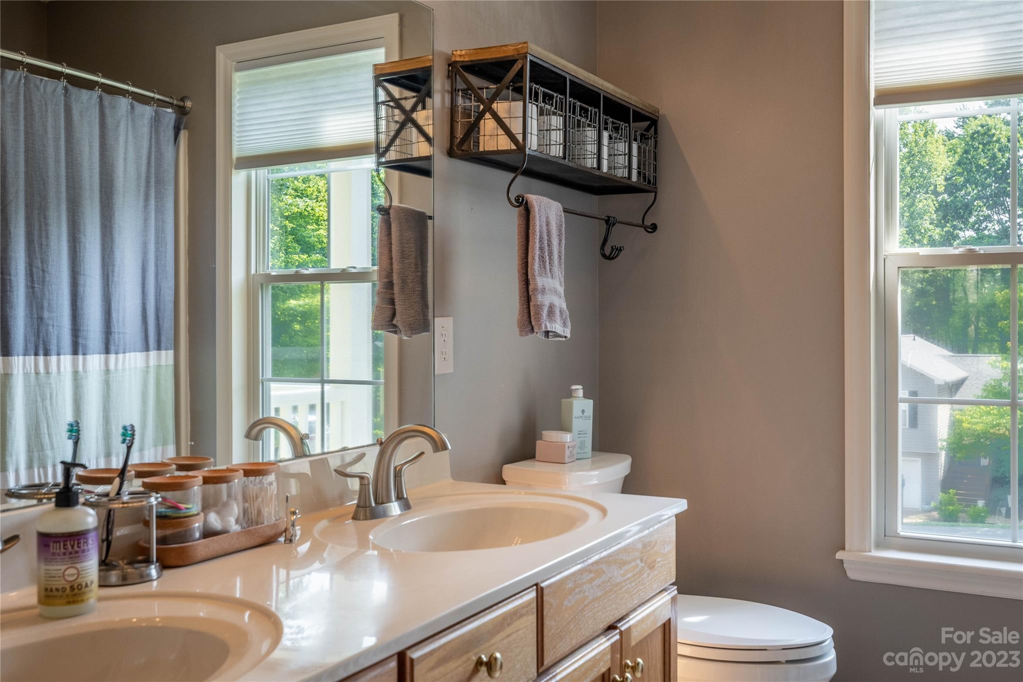 4331 Acorn Trace Morganton, NC 28655 - Photo 11 of 22 a bathroom with a granite countertop sink mirror vanity and toilet