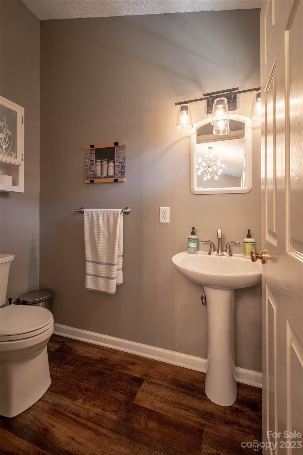 4331 Acorn Trace Morganton, NC 28655 - Photo 16 of 22 a bathroom with a sink toilet and mirror