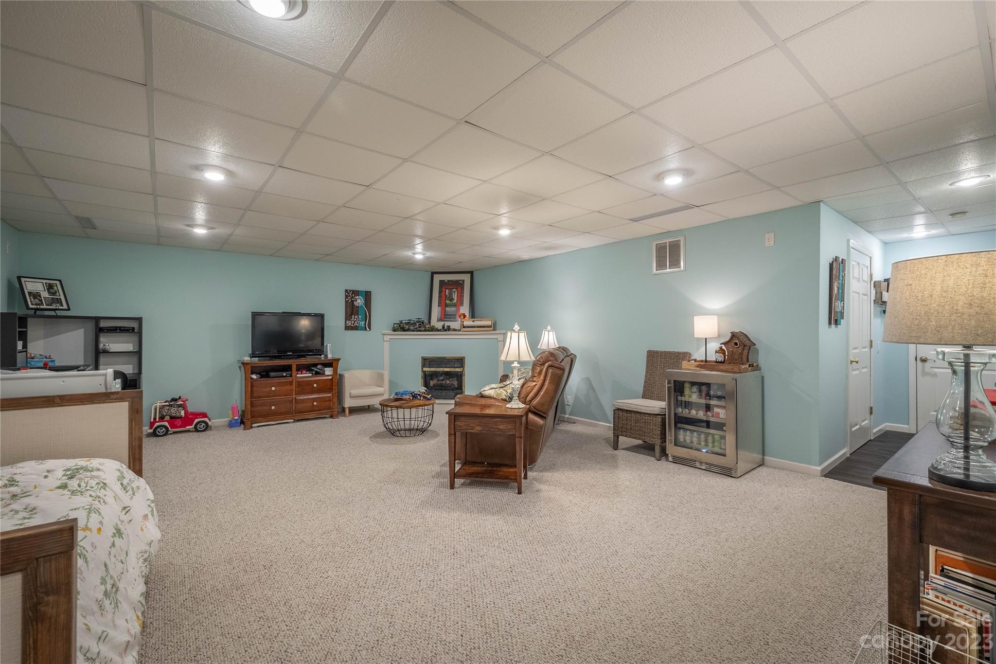 4331 Acorn Trace Morganton, NC 28655 - Photo 17 of 22 a living room with furniture a window and a flat screen tv