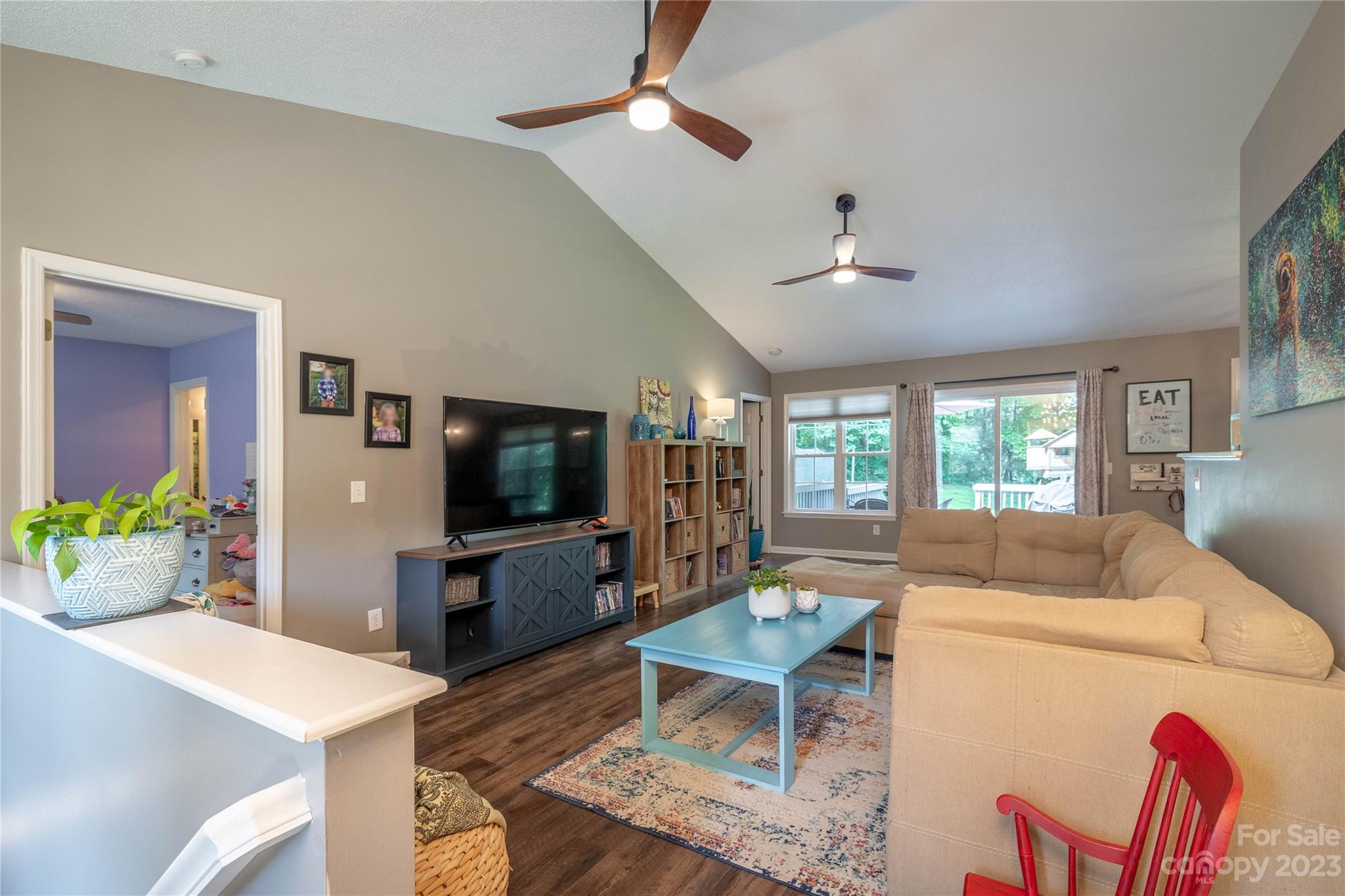 4331 Acorn Trace Morganton, NC 28655 - Photo 4 of 22 a living room with furniture a flat screen tv and a dining table