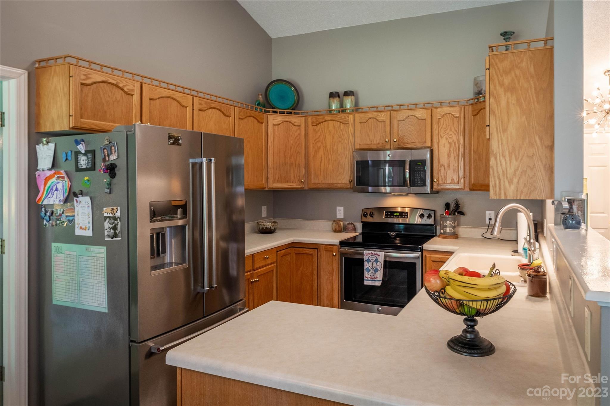 4331 Acorn Trace Morganton, NC 28655 - Photo 6 of 22 a kitchen with a refrigerator a stove a sink a counter top space and cabinets
