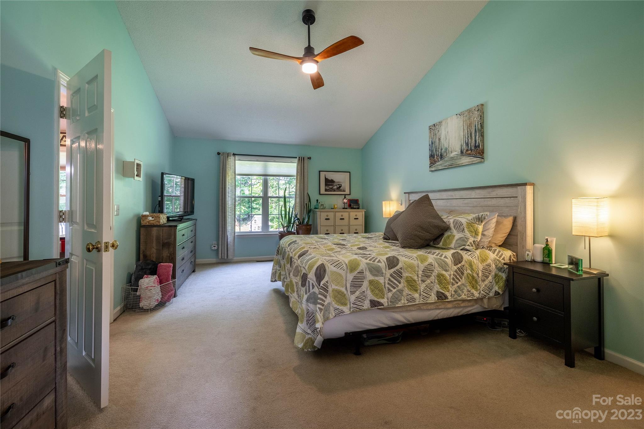 4331 Acorn Trace Morganton, NC 28655 - Photo 9 of 22 a bedroom with a bed and a chandelier